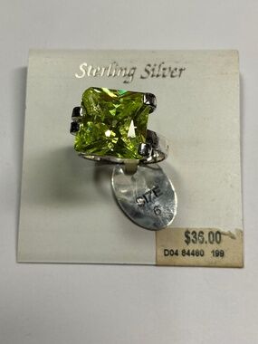 Sterling Silver Ring with a Faceted Green Stone. Size 6.5
